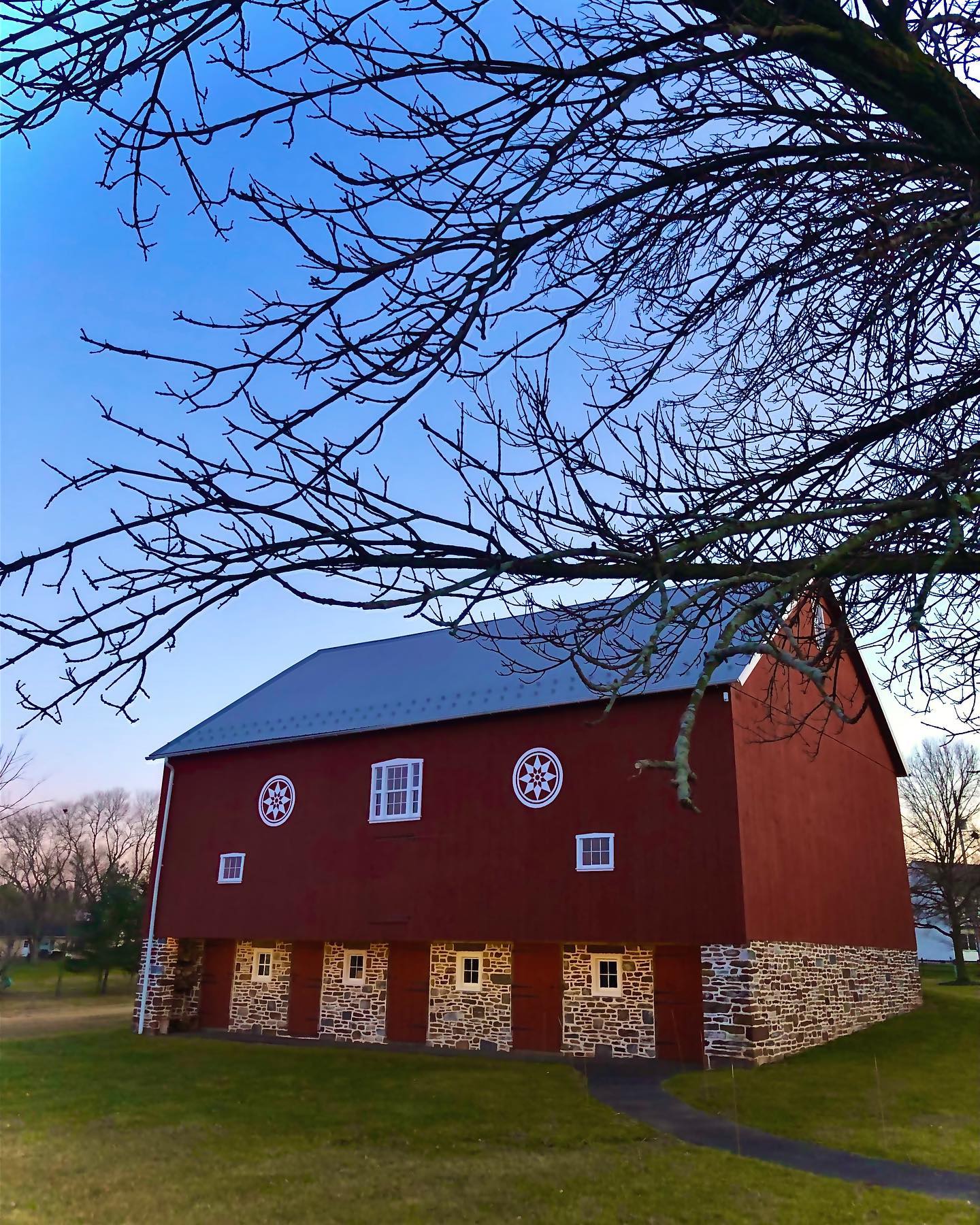 Guests mingling at rustic barn wedding
